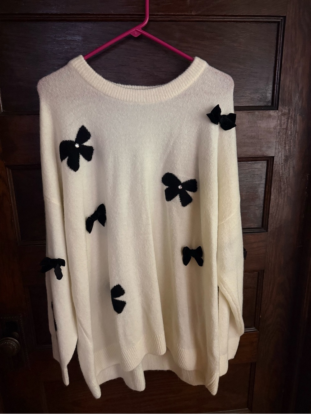 Women's Cream Sweater with Black Bow Accents